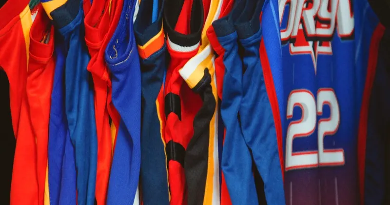 a group of blue and red sports jerseys